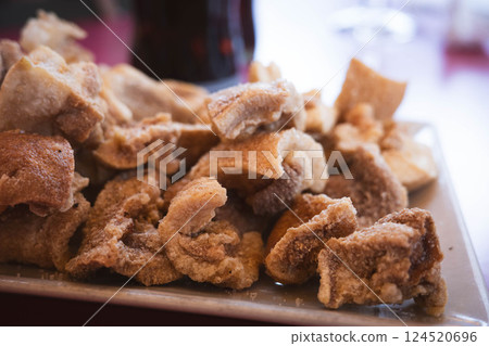 Delicious fried pig snout tapa High on Plate 124520696