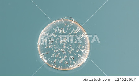 Transparent gel droplet with air bubbles under soft diffused light in extreme close-up Transparent gel droplet with air bubbles under soft diffused light in extreme close-up 124520697