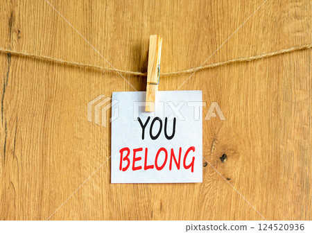 Belonging and you belong symbol. Concept words You belong on beautiful white paper on wooden clothespin. Beautiful wooden background. Business belonging and you belong concept. Copy space. Belonging and you belong symbol. Concept words You belong on beautiful white paper on wooden clothespin. Beautiful wooden background. Business belonging and you belong concept. Copy space. 124520936
