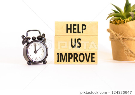 Help us improve symbol. Concept words Help us improve on beautiful wooden blocks. Beautiful white background. Black alarm clock. Business motivational help us improve concept. Copy space. 124520947