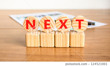 Next symbol. Concept word Next on beautiful wooden circles on wooden blocks. Beautiful wooden table white background. Business, lifestyle, support and next concept. Copy space. Next symbol. Concept word Next on beautiful wooden circles on wooden blocks. Beautiful wooden table white background. Business, lifestyle, support and next concept. Copy space. 124521001