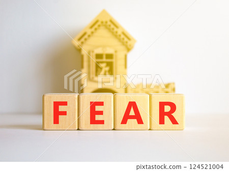 Fear symbol. Concept word Fear on beautiful wooden blocks. Beautiful white table white background. Wooden beautiful house. Business, lifestyle and fear concept. Copy space. Fear symbol. Concept word Fear on beautiful wooden blocks. Beautiful white table white background. Wooden beautiful house. Business, lifestyle and fear concept. Copy space. 124521004