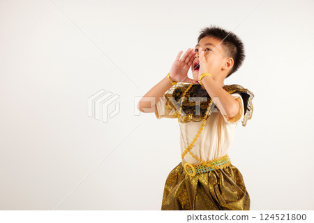 Portrait of Thailand kid boy smiling traditional Thai dress costume use hand covering her mouth, studio shot isolated white background, primarily engaged in lively conversation, making an announcement Portrait of Thailand kid boy smiling traditional Thai dress costume use hand covering her mouth, studio shot isolated white background, primarily engaged in lively conversation, making an announcement 124521800