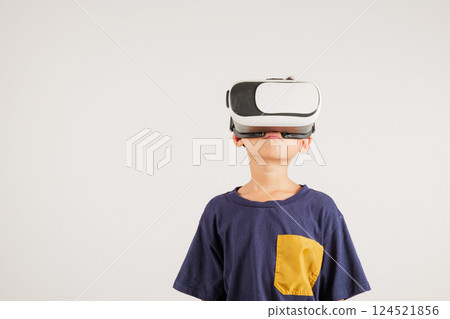 Smiling young kid boy confidence excited wear VR headset device during virtual reality experience isolated white background, Asian happy portrait primary child playing video game studio shot Smiling young kid boy confidence excited wear VR headset device during virtual reality experience isolated white background, Asian happy portrait primary child playing video game studio shot 124521856
