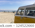 Camper Trailer, Van Parked In The Seashore, Yellow Sand And Water, Ocean Line On Background, Nobody. Travel Destination, Summer And Vacation. Horizontal. 124522660