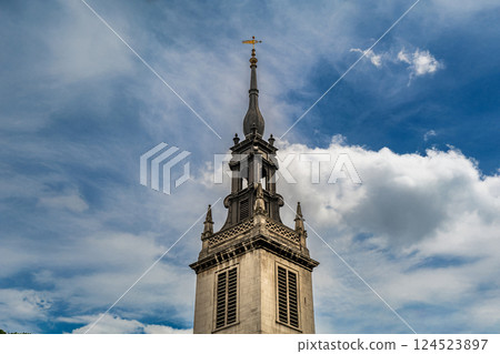 The Church of St. Augustine s towering spire, adorned with exquisite Baroque details, stands as a testament to classical European architecture. 124523897