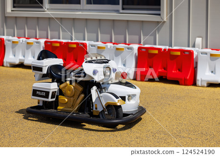 Police motorcycle on electric playground equipment in the park Police motorcycle on electric playground equipment in the park 124524190