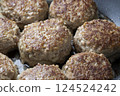 Cooking scene of lotus root stuffed with meat. 124524242