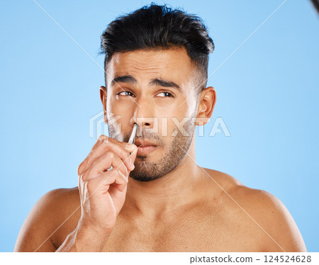 Beauty, hair and nose tweezers with man in a studio for cleaning, wellness and skincare against a blue background. Face, hair removal and mexican model grooming, hygiene and tweezer pamper treatment Beauty, hair and nose tweezers with man in a studio for cleaning, wellness and skincare against a blue background. Face, hair removal and mexican model grooming, hygiene and tweezer pamper treatment 124524628