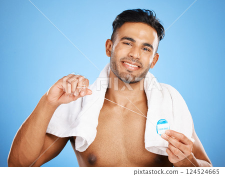 Dental care, floss and man cleaning teeth for oral hygiene routine, self care flossing or tooth healthcare. Mouth plaque treatment, aesthetic smile and beauty portrait of model with dental product 124524665