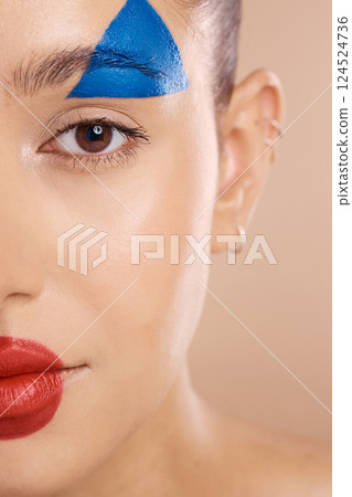 Art, woman face and makeup clown paint, cosmetics and skincare being goofy, facial and brown studio background. Portrait, young female happy or creative girl with colorful, smooth or skin artist Art, woman face and makeup clown paint, cosmetics and skincare being goofy, facial and brown studio background. Portrait, young female happy or creative girl with colorful, smooth or skin artist 124524736