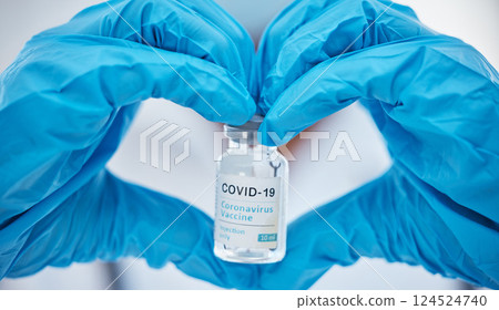 Covid, vaccine and heart with hands of doctor for medicine, and lab research with bottle. Medical, healthcare and drug with clinic worker holding treatment for pharmacy, innovation and science 124524740