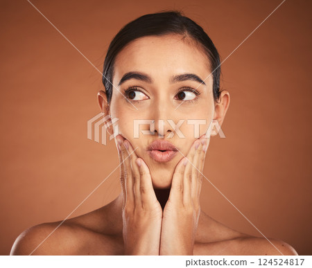 Woman with kiss lips, natural makeup on brown studio background and luxury skincare in dermatology spa. Latino girl with model pose, cosmetics beauty with lipstick and apply cream to face 124524817