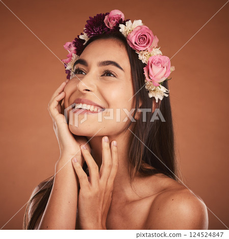 Flower, crown and woman in beauty studio, skincare and wellness while grooming on orange background. Face, rose and girl model smile, relax and happy with floral product, facial and plant aesthetic Flower, crown and woman in beauty studio, skincare and wellness while grooming on orange background. Face, rose and girl model smile, relax and happy with floral product, facial and plant aesthetic 124524847