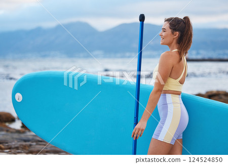 Woman, happy and surfboard relax on beach for sports exercise wellness on travel vacation. Young athlete surfer, freedom smile and thinking for peace or mental health on rocks outdoors with blue sky Woman, happy and surfboard relax on beach for sports exercise wellness on travel vacation. Young athlete surfer, freedom smile and thinking for peace or mental health on rocks outdoors with blue sky 124524850