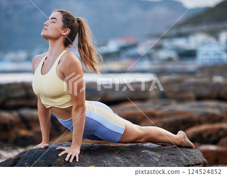 Meditation, yoga stretching and woman on rock at beach for mindfulness peace exercise, spiritual healing and wellness training to relax. Zen workout, outdoor lifestyle and pilates for health fitness Meditation, yoga stretching and woman on rock at beach for mindfulness peace exercise, spiritual healing and wellness training to relax. Zen workout, outdoor lifestyle and pilates for health fitness 124524852