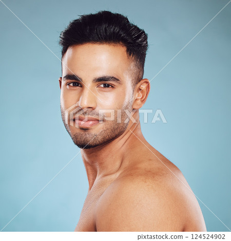 Health skincare and a portrait of man, topless with healthy skin and natural glow after detox facial and smile on face in India. Male body care, fitness and self love in studio with blue background. Health skincare and a portrait of man, topless with healthy skin and natural glow after detox facial and smile on face in India. Male body care, fitness and self love in studio with blue background. 124524902