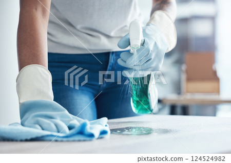 Hands spray, cleaning service and product for dust on table as cleaner on kitchen counter or dirty home furniture. Hand, worker or janitor wash a messy surface with fresh liquid and cloth with gloves Hands spray, cleaning service and product for dust on table as cleaner on kitchen counter or dirty home furniture. Hand, worker or janitor wash a messy surface with fresh liquid and cloth with gloves 124524982