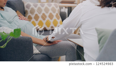 pregnant woman, consulting and nurse on sofa in medical health center. Young female, new mother support and surgery healthcare insurance worker communication with patient or pregnancy treatment care pregnant woman, consulting and nurse on sofa in medical health center. Young female, new mother support and surgery healthcare insurance worker communication with patient or pregnancy treatment care 124524983