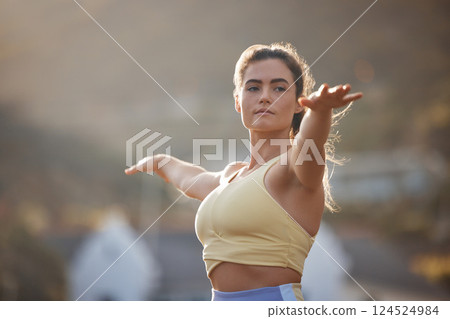 Yoga, fitness and exercise with a woman training outdoor for health, wellness or serene lifestyle. Workout, motivation and zen with a young female athlete exercising outside alone to stay active 124524984