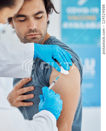 Covid, vaccine and injection with a man patient getting his booster shot in a hospital with a doctor in gloves. Medicine, health and insurance with a male in a clinic to boost his immune system Covid, vaccine and injection with a man patient getting his booster shot in a hospital with a doctor in gloves. Medicine, health and insurance with a male in a clinic to boost his immune system 124524986