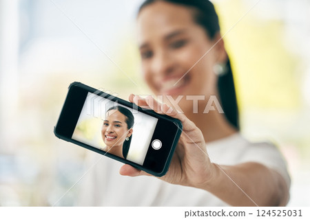 Phone, selfie and screen with a woman taking a photograph on her smartphone for social media. Face, portrait and headshot with a female posing for a picture using wireless mobile technology alone Phone, selfie and screen with a woman taking a photograph on her smartphone for social media. Face, portrait and headshot with a female posing for a picture using wireless mobile technology alone 124525031
