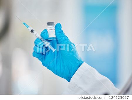 Doctor hands, covid or vaccine bottle with syringe in hospital, clinic or pharmacy for health, wellness or medical compliance. Zoom, nurse or healthcare worker and covid 19 booster medicine or needle 124525037