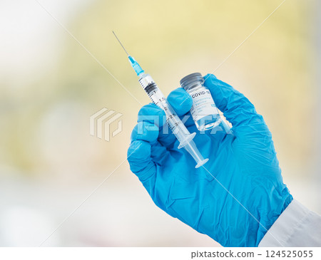 Covid vaccine, bottle and needle in hand for medical innovation, safety and compliance in hospital, clinic or laboratory. Covid 19 vaccination doctor or pharmacist for corona virus healthcare mock up Covid vaccine, bottle and needle in hand for medical innovation, safety and compliance in hospital, clinic or laboratory. Covid 19 vaccination doctor or pharmacist for corona virus healthcare mock up 124525055