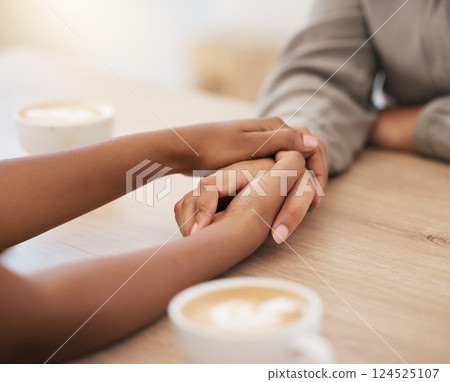 Coffee, women and holding hands in support, trust or help for mental health, stress or depression in coffee shop, restaurant or cafe. Zoom, friends and people in comfort, solidarity and unity therapy 124525107