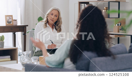 Psychologist, woman in therapy and counseling meeting talking mental health, work burnout and anxiety or depression. Therapist office, mind wellness and professional psychiatrist to help psychology 124525108