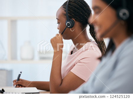 Black woman, notebook writing or headset in call center, contact us or crm consulting office in telemarketing help. Receptionist, consultant agent or customer support workers in communication company 124525120