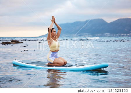 Yoga, beach and woman in the water for meditation, training of mind and spiritual wellness. Peace, relax and girl with paddle board, zen and motivation while surfing on a surfboard in sea in summer Yoga, beach and woman in the water for meditation, training of mind and spiritual wellness. Peace, relax and girl with paddle board, zen and motivation while surfing on a surfboard in sea in summer 124525163
