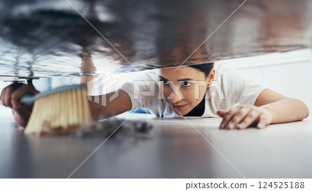 Woman, hand broom or sweeping dust in house, home or hotel bedroom in housekeeping cleaning, cleaner service or hygiene maintenance. Brush, dirty or messy floor spring cleaning under hospitality sofa 124525188