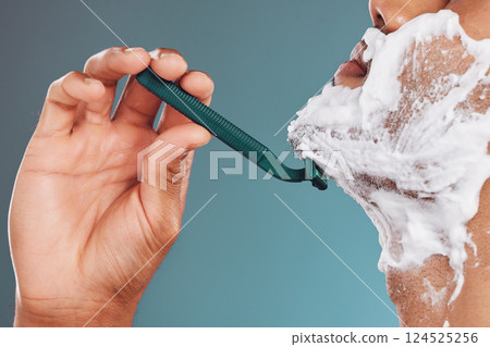 Shaving foam, razor and skincare mockup with man cleaning his face with care for healthy, clean and smooth skin. Male in studio for dermatology, shaved beard and cosmetics for wellness and health 124525256