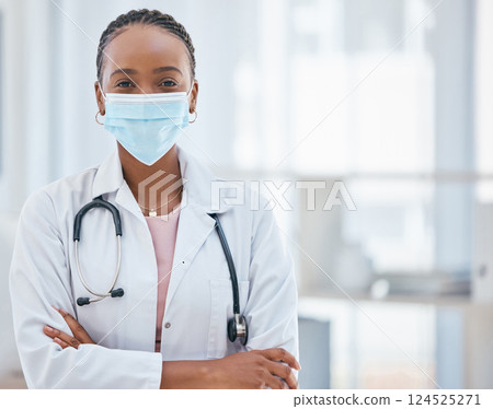 Covid, doctor and confident black woman in healthcare in face mask, leadership mindset and success in medicine. Safety, vision and woman medical leader with vision to help support Africa in pandemic 124525271