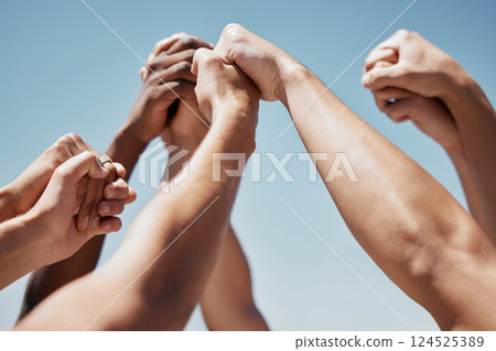 Pray, hands and community praying against a blue sky background for worship, praise and religion outside. Prayer, church and hand of people united in support of love, peace and God by spiritual group 124525389