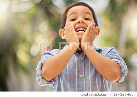 Backyard, portrait and surprised child with a smile playing outdoor in nature at his home. Happy, shocked and wow expression of a boy kid having fun in the garden during summer at his house in Brazil Backyard, portrait and surprised child with a smile playing outdoor in nature at his home. Happy, shocked and wow expression of a boy kid having fun in the garden during summer at his house in Brazil 124525403