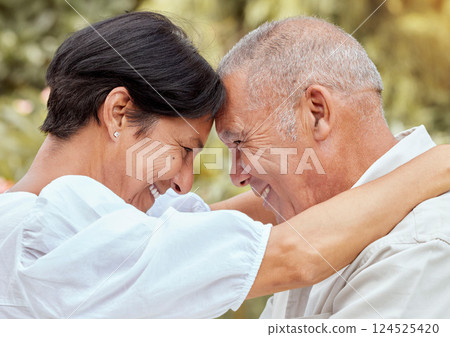 Senior couple, hug and forehead with smile for love, romance and embrace in relationship happiness in the outdoors. Happy mature man and woman hugging, smiling and romantic bonding together in nature Senior couple, hug and forehead with smile for love, romance and embrace in relationship happiness in the outdoors. Happy mature man and woman hugging, smiling and romantic bonding together in nature 124525420