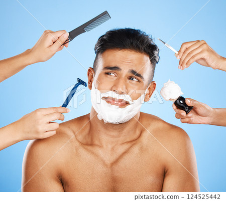 Hands, cleaning and man in studio for makeover, skincare and shaving against a blue background. Hand, beauty and luxury with wellness model grooming, hair and skin treatment with cosmetic product 124525442