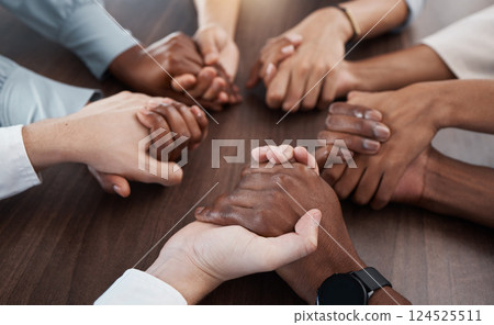 People, holding hands and care in diversity for trust, unity or community support together on a table. Hands of diverse group in collaboration for teamwork, meeting or social circle in hope at work 124525511