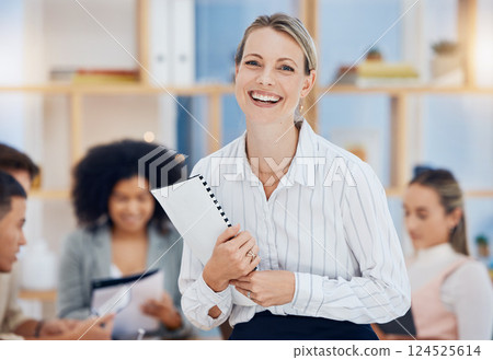 Meeting, leadership and happy with a business woman holding documents in the boardroom for training or coaching. Marketing, team and manager with a female employee working with a group in the office 124525614