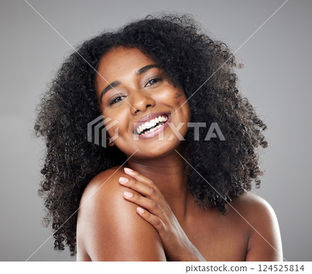Face, beauty and skincare with a model black woman in studio on a gray background with a happy smile. Portrait, cosmetics and wellness with an attractive young female posing to promote a product 124525814