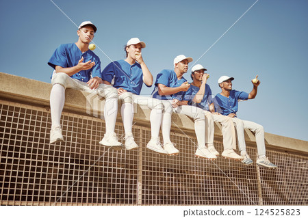 Sports, baseball and team of men together smiling and happy sitting in row eating apple. Smile, teamwork and professional baseball team relax watching competition game or training workout session. 124525823