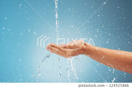 Abstract water, splash and woman cleaning hands . Clean flow eco friendly healthy, sustainable waterfall environment and earth day fresh cold wet hand under water with blue background in studio 124525866