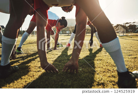 Soccer field, sports men and stretching body on sports stadium grass to start training, fitness and exercise workout. Football player team group warm up together before competition game performance Soccer field, sports men and stretching body on sports stadium grass to start training, fitness and exercise workout. Football player team group warm up together before competition game performance 124525919