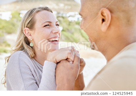 Beach, holding hands and man propose to woman on holiday by sea, happy and smiling together. Affection, romance and multicultural couple by ocean, enjoying vacation and bonding on weekend in summer Beach, holding hands and man propose to woman on holiday by sea, happy and smiling together. Affection, romance and multicultural couple by ocean, enjoying vacation and bonding on weekend in summer 124525945