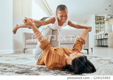 Mother, girl love and playing airplane fly in air bonding activity together in the house living room. Happy mom, excited laugh child or kid and fun game spend quality time on floor at family home 124525993