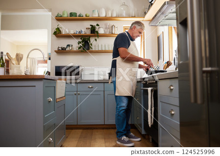Senior man, cooking food and stove kitchen, lunch meal and dinner in frying pan in New Zealand home. Mature house chef with apron make easy recipe, cuisine and fresh diet for dining in retirement 124525996