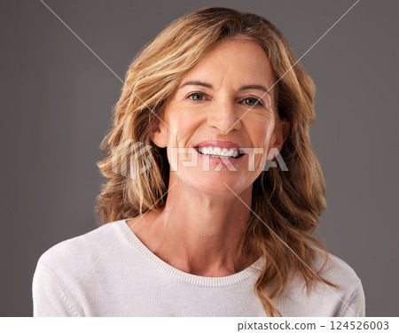 Beauty, skincare and portrait of senior woman with wellness, health and anti aging face routine. Happy, smile and elderly lady with wrinkles and cosmetic treatment isolated by gray studio background. Beauty, skincare and portrait of senior woman with wellness, health and anti aging face routine. Happy, smile and elderly lady with wrinkles and cosmetic treatment isolated by gray studio background. 124526003