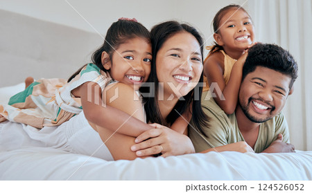 Love, bed and portrait of relax happy family bonding, having fun and enjoy quality time together in Malaysia hotel bedroom. Hospitality, hug and holiday vacation for excited children, dad and mother 124526052